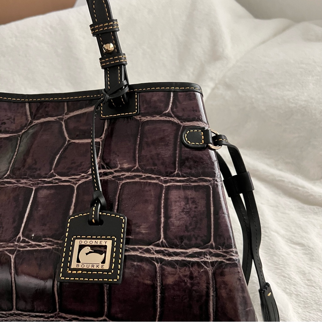 Dooney And Bourke Croco Purple Embossed Double Strapped Tassel Bag
